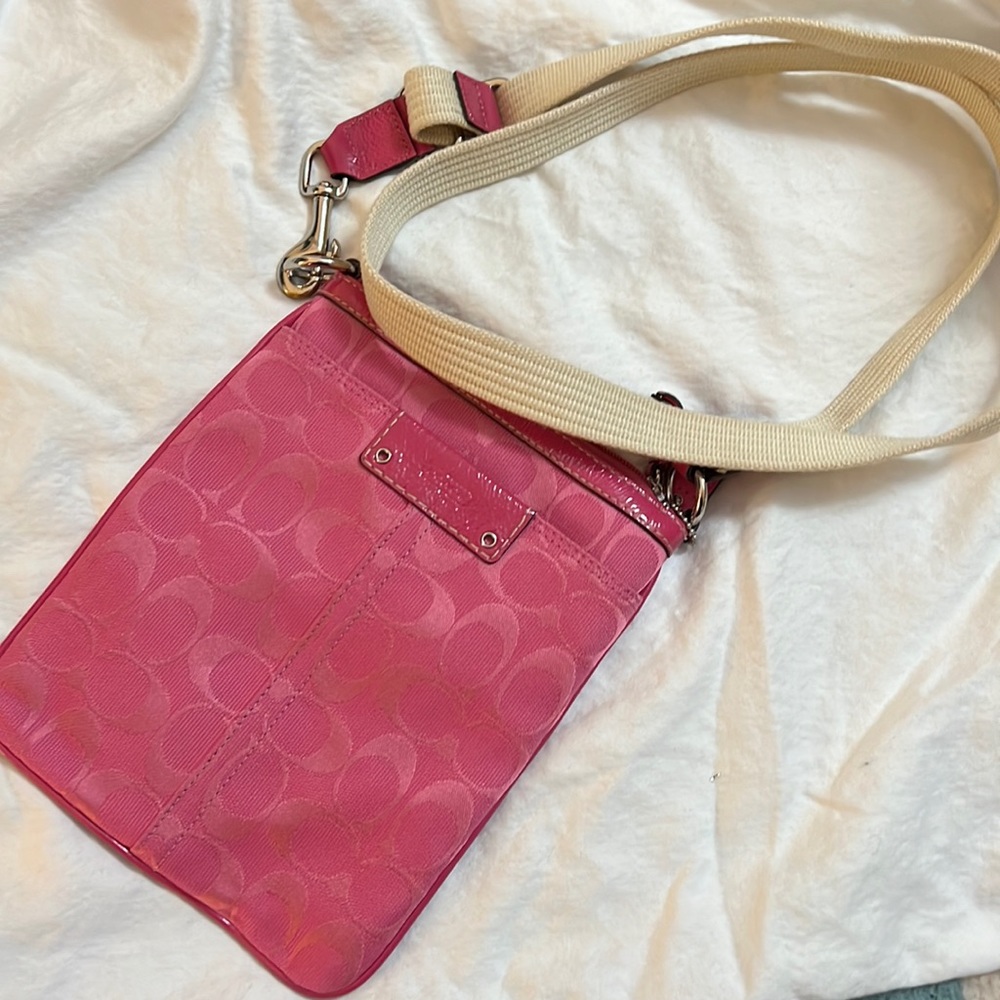 Coach crossbody bag great for vacation.